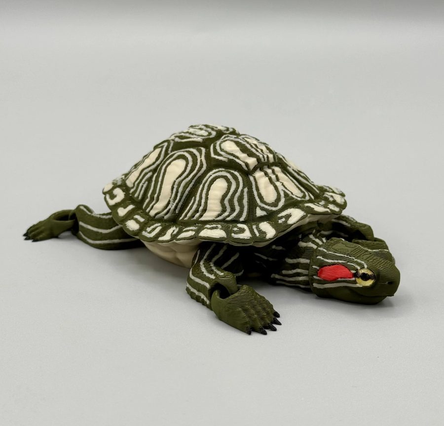 3D printed articulated red-eared slider turtle with olive green and cream shell pattern